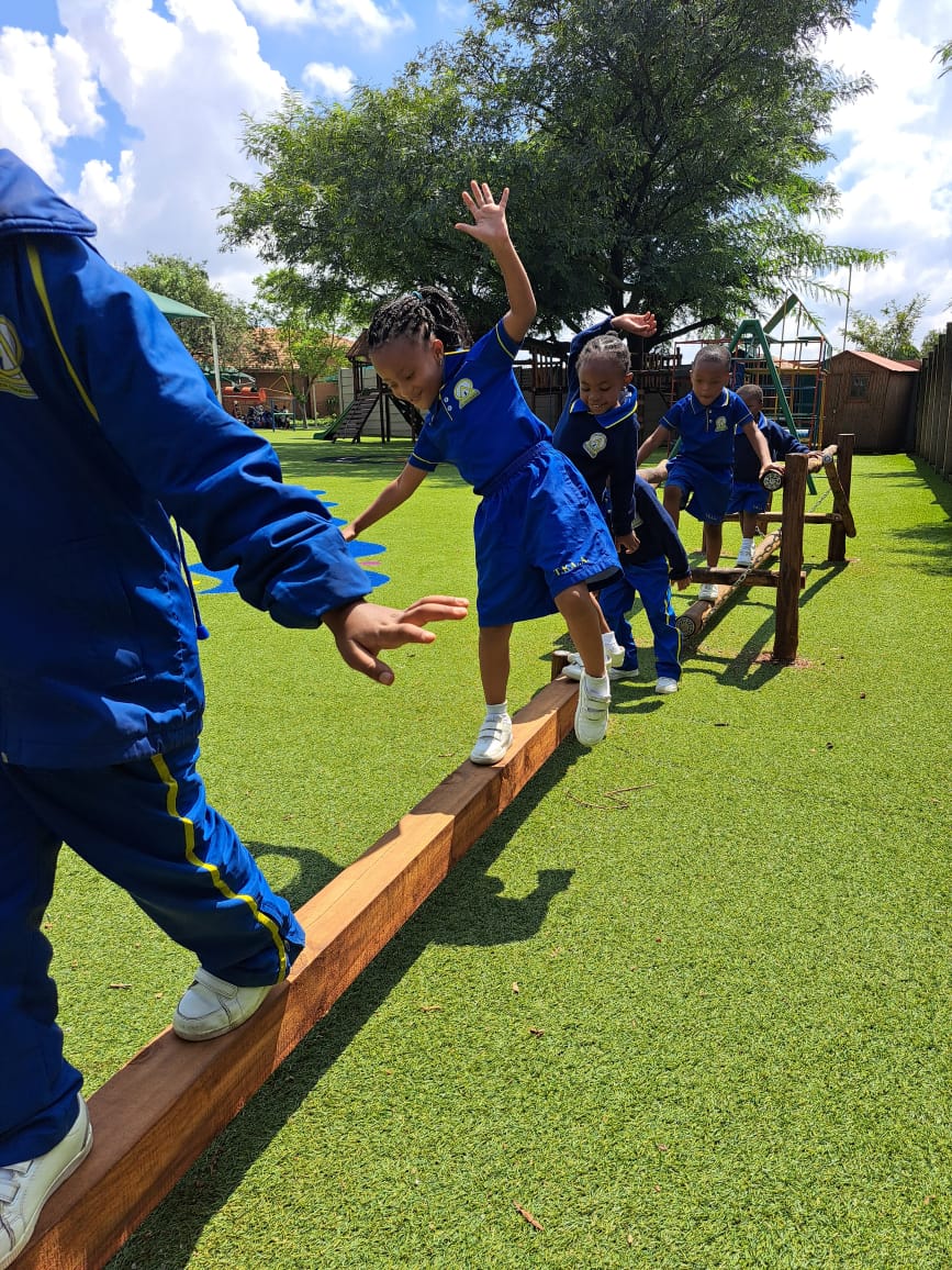 Pre-Primary learner on the balance beam
