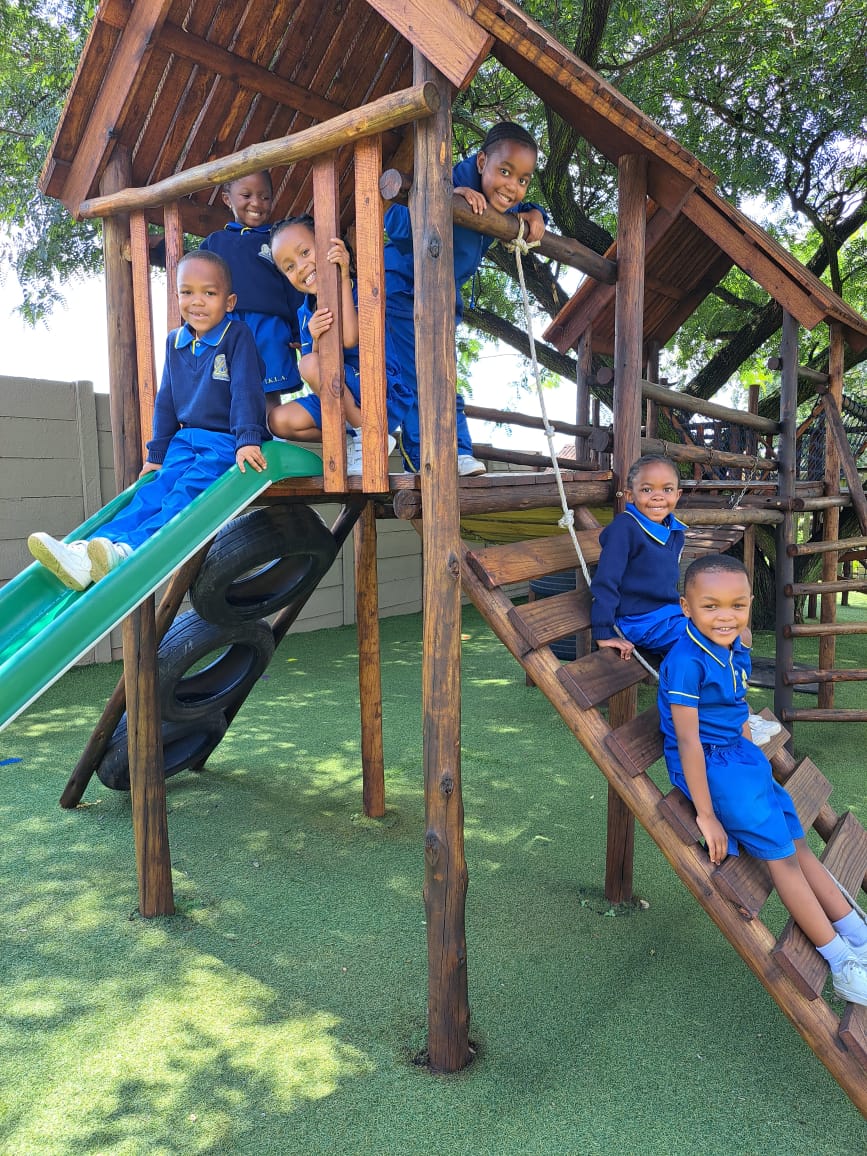 Pre-Primary learners on the jungle gym