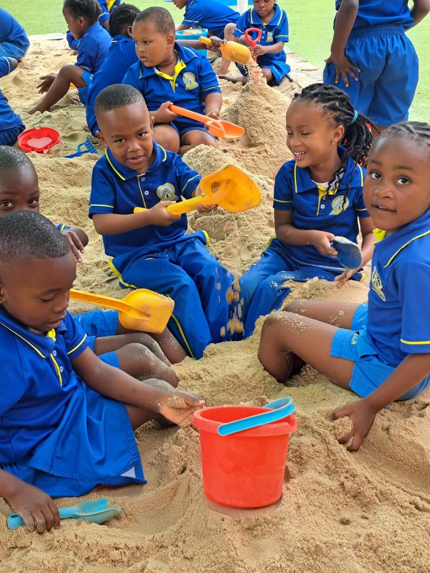 Pre-Primary learners playing in the sandpit